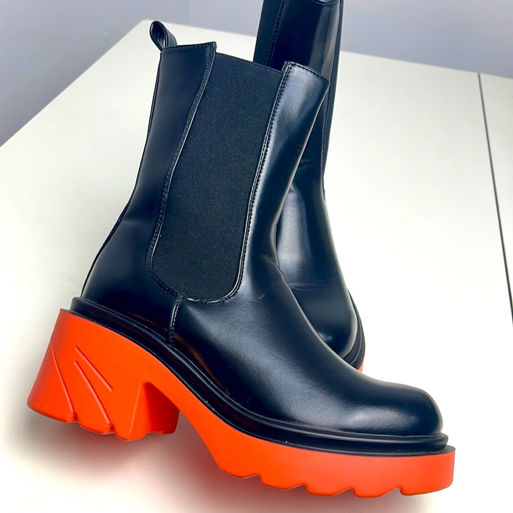 Super Trendy black ankle boot with orange sole women size 6.5.